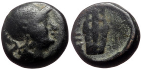 Aeolis, Aigai AE (Bronze, 1.28g, 9mm) 2nd-1st century BC 
Obv: Helmeted head of Athena right 
Rev: AIΓAE, Lyre.
Ref: ???