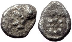 Ionia, Uncertain AR Hemiobol (Silver, 0.47 g 8mm). 5th century BC.
Obv: Head of Athena (?) to left, wearing Corinthian helmet. 
Rev: Star of eight ray...