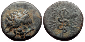 Mysia, Pergamon AE (Bronze, 4.08 g 17mm) ca 133-27 BC.
Obv: Laureate head of Asklepios right.
Rev: AΣKΛHΠIOY ΣΩTHPOΣ, serpent-entwined staff of Asklep...