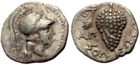 Cilicia, Soli AR Obol (Silver, 0.61g, 11mm) ca 350-330 BC. 
Obv: Head of Athena right in crested Corinthian helmet; dotted border 
Rev: ΣOΛEΩN, bunch ...