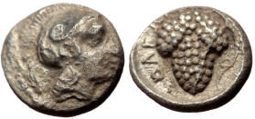 Cilicia, Soli AR Obol (Silver, 0.69g, 9mm) ca 350-330 BC. 
Obv: Head of Athena right, in crested Corinthian helmet 
Rev: ΣOΛEΩN, bunch of grapes, with...