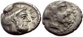 Cilicia, Nagidos AR Obol (Silver, 0.69g, 9.5mm) ca 400-380 BC. 
Obv: Bearded head of Pan to right. 
Rev: NAΓI, Bearded head of Dionysos to right. 
Ref...