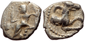 Lycaonia, Laranda AR Obol (Silver, 0.65g, 10mm) ca 324/3 BC. 
Obv: Baaltars seated left, torso facing, holding grain ear and grape bunch in extended r...