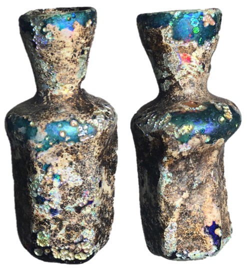 Roman Empire, 1st - 3rd Century AD Glass bottle measuring 56mm tall. Intact with...