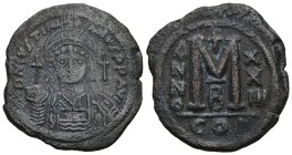 Justinian I, AD 527-565. AE, Follis. 16.51 g. 34.31 mm. Constantinople.
Obv: DNIVSTINI-ANVS PPAVC. Frontal bust of Justinian I wearing helmet with pl...