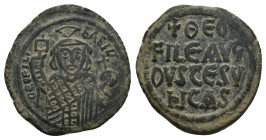 Theophilus, AD 829-842. AE, Follis. 7.91 g 27.30 mm. Constantinople.
Obv: ΘEOFIL-bASIL. Crowned, three-quarter length figure of Theophilus facing, pel...