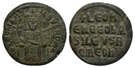 Leo VI the Wise, AD 886-912. AE, Follis. 6.67 g. 26.00 mm. Constantinople.
Obv: + LЄOҺЬAS-ILЄVSROM. Leo, crowned and wearing loros, seated facing on l...
