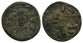 Nicephorus Basilacius (?), usurper. 1078 AD. AE, Follis. 5.97 g. 26.29 mm.
Obv: Bust of Christ facing, dotted cross behind head, holding book of Gospe...