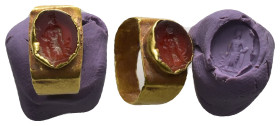 Greco-Roman gem in a golden ring (AD 2nd–3rd centuries)
A golden ring with red carnelian depicting figure of bearded Asclepius, standing facing on a ...