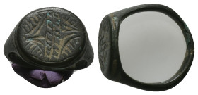 AE Early Byzantine signet-ring (AD 6th-8th centuries)
Bronze signet-ring; slightly raised circular bezel engraved with linear design.
Weight: 7.14 g...