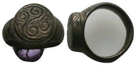 AE Early Byzantine signet-ring (AD 6th-8th centuries)
Bronze signet-ring; raised round bezel engraved with spiral design.
Weight: 14.54 g.
Diameter...