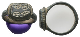 AE Byzantine finger-ring (c. AD 6th–8th centuries)
Bronze Byzantine finger-ring, raised, oval bezel engraved with linear design.
Weight: 4.59 g.
Di...