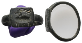 AE Roman finger-ring (AD 2nd–3rd centuries)
Bronze finger-ring; rectangular bezel with engraved design: an antilope standing to left.
Weight: 5.78 g...