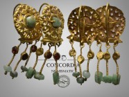 Roman gold pendant ear-rings with green composition drops (AD 3rd century)
A matched pair of gold earrings, each a domed openwork plaque with central...