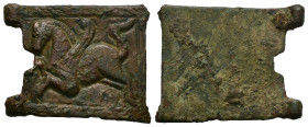 Byzantine Bronze, belt-buckle (AD 7th-8th centuries).
Belt buckle with rectangular body, embossed figure of a stylised winged horse to the plate.
Cf...