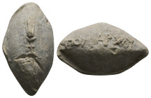 PB Greek sling bullet. (c. 4th–1st centuries BC)
Sling bullet is with an image of an ear of wheat on one side and with a name Poliarchos (Πολίαρχος) ...