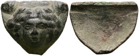 Hellenistic, Bronze Applique from Krater (3rd-2nd BC).
Medusa with snake hair, facing. Two lion heads above right and left. Medusa is featuring a str...