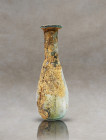 Discover an exquisite ancient Roman glass perfume holder, a testament to the elegance of the era. This captivating artifact features a pyriform body t...