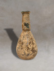 Eastern Mediterranean Roman production this flask is made of pale glass and is comprised of a small piriform body with a cylindrical neck terminating ...