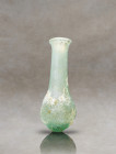 Embark on a journey to ancient Rome with this captivating translucent-glass unguentarium. Adorned with a pyriform body, it boasts a gracefully taperin...