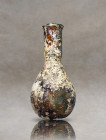 Ancient roman bottle, larger flared base which leads to a narrow cylindrical neck and flared and folded rimInventory code : SG206 / 13.2 cm
W :
H :