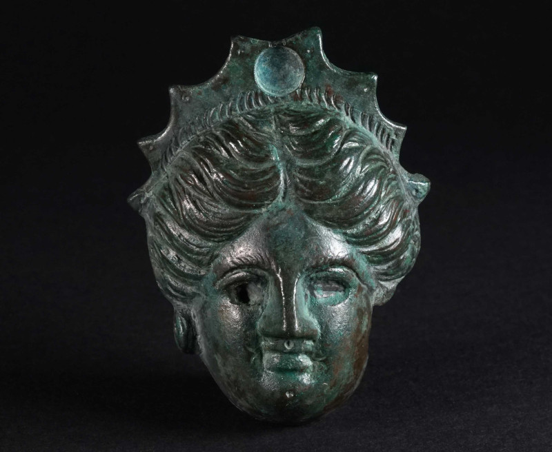 A LARGE ROMAN BRONZE APPLIQUE WITH A FEMALE HEAD Circa 1st-2nd century AD. Appli...