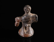A ROMAN MINIATURE BRONZE STATUETTE OF A GOD Circa 2nd-3rd century AD. The small (ithyphallic) statuette with its conical base is cast in one piece. Th...