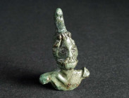 A ROMAN BRONZE ATTACHMENT DEPICTING A BEARDED GOD Circa 2nd-3rd century AD. Small, draped bust possibly showing Jupiter Sabazius. H 46 mm

Ex privat...