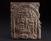 A ROMAN DANUBIAN RIDER LEAD VOTIVE PLAQUE Circa 3rd-4th century AD. Rectangular Mystery Plaque with an arched aedicula/temple with two pillars. Above ...