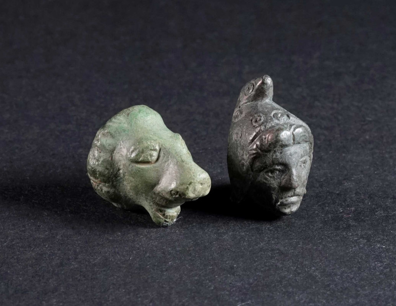 TWO ROMAN BRONZE FIGURAL APPLIQUES Circa 2nd-3rd century AD. One in the shape of...
