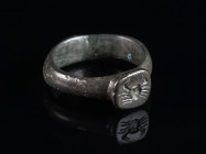 A LATE ROMAN OR EARLY BYZANTINE BRONZE RING WITH A CRAB Circa 4th-6th century AD. With plain hoop and squarish bezel. Ring size 46 (EU)

Ex private ...