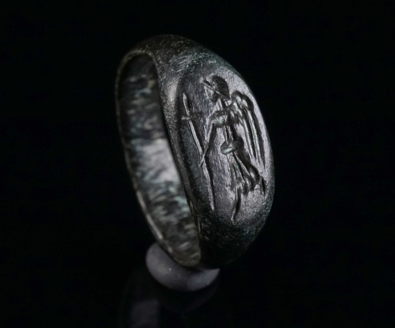 AN EARLY BYZANTINE BRONZE RING SHOWING AN ANGEL WITH CROSS Circa 6th-7th century...