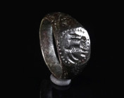 A BYZANTINE BRONZE RING DEPICTING A HARE Circa 6th-9th century AD. The shoulders decorated with a dotted design; the bezel showing a stylised hare str...