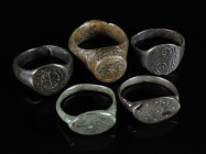 A GROUP OF FIVE MEDIEVAL/EARLY MODERN BRONZE RINGS Circa 12th-16th century AD. All with decorated bezel. Ring sizes 54-58 (EU) 

Ex private collecti...
