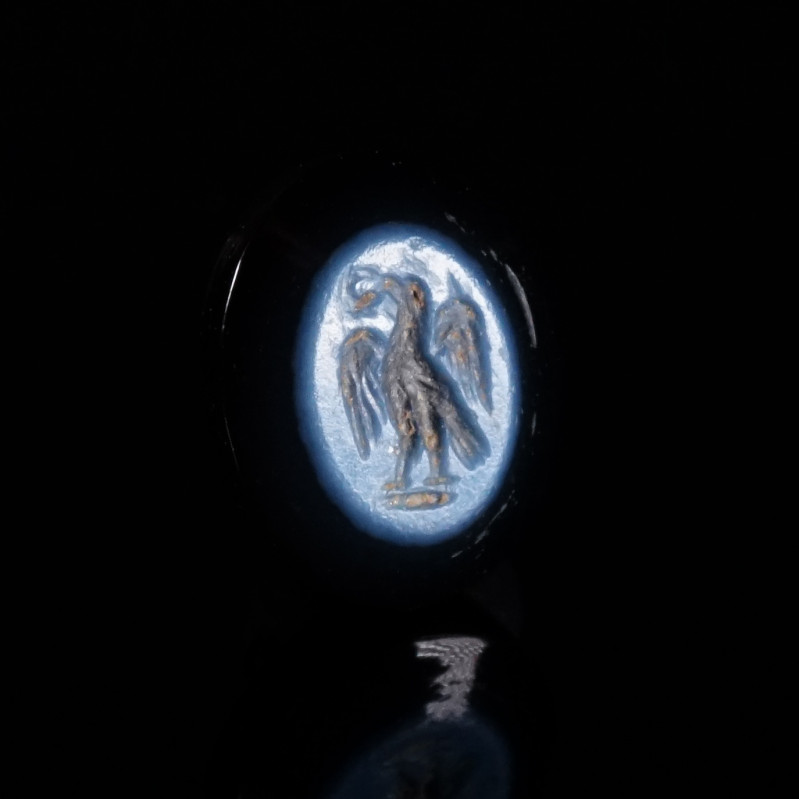 A ROMAN NICOLO INTAGLIO WITH AN EAGLE Circa 1st-3rd century AD. Oval banded agat...