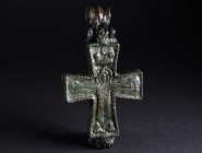 A BYZANTINE BRONZE RELIQUARY CROSS WITH CHRIST AND MARY Circa 9th-11th century AD. Large reliquary cross (enkolpion) depicting the crucifixion on the ...