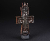 A BYZANTINE BRONZE RELIQUARY CROSS WITH CHRIST AND MARY Circa 10th-12th century AD. Reliquary cross (enkolpion) depicting the crucifixion on the front...
