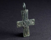 A DECORATED BYZANTINE BRONZE CROSS PENDANT Circa 9th-11th century AD. One side decorated with ornaments in cross shape. H 42 mm

Ex private collecti...