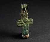 A SMALL BYZANTINE BRONZE RELIQUARY CROSS Circa 10th-12th century AD. Reliquary cross (enkolpion) depicting Virgin Mary with her hands upraised in pray...