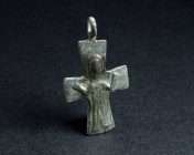 A BYZANTINE BRONZE CROSS PENDANT WITH VIRGIN MARY Circa 9th-11th century AD. Depicting Virgin Mary with her hands upraised in prayer ('orans'). Slight...