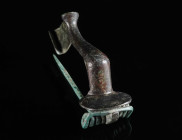 A LARGE ROMAN BRONZE KNEE BROOCH Circa 2nd-3rd century AD. With spring and pin. L 55 mm

Acquired on the UK art market.