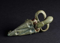 A BYZANTINE BRONZE BUCKLE WITH TRIANGULAR PLATE Circa 7th-8th century AD. Plate with geometric design; three attachment lugs on the reverse. L 63 mm
...