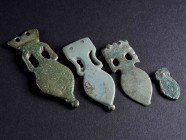 A GROUP OF FOUR ROMAN AMPHORA-SHAPED BRONZE STRAP-ENDS Circa 4th century AD. Late Roman strap-ends from military belts. L 20-58 mm

Ex private colle...