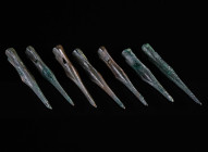 A GROUP OF SEVEN SCYTHIAN OR GREEK BRONZE ARROWHEADS Circa 6th-3rd century BC. Triangular cross-section; with socket and a very long point. Commonly r...