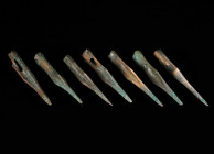 A GROUP OF SEVEN SCYTHIAN OR GREEK BRONZE ARROWHEADS Circa 6th-3rd century BC. Triangular cross-section; with socket and a very long point. Commonly r...