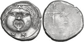 Greek Italy. Etruria, Populonia. Second Metus Group. AR 20-Asses, 3rd century BC. Obv. Facing head of Metus, tongue protruding, hair bound with diadem...