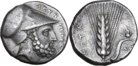Greek Italy. Southern Lucania, Metapontum. AR Stater, c. 340-330 BC. Obv. ΛEΥKIΠΠOΣ. Head of bearded Leukippos right, wearing Corinthian helmet; [dog ...