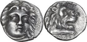Greek Asia. Caria, Knidos. AR Didrachm, c. 210-185 BC. Philinos, magistrate. Obv. Head of Helios facing slightly right. Rev. Forepart of roaring lion ...