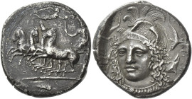 Syracuse
Tetradrachm signed by Eukleidas circa 413-399, AR 27 mm, 16.56 g. Fast quadriga driven l. by female charioteer, holding reins in l. hand and...