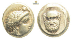 Lesbos. Mytilene. c. 350 BC. EL hecte,. Obv: Head of Dionysos facing right, wearing ivy-wreath. Rx: Mask of Silenos facing in thin square frame, all i...